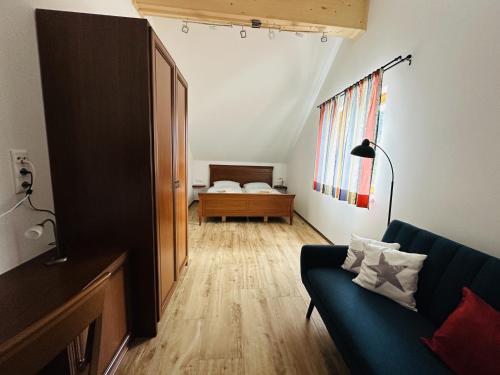 a living room with a couch and a bedroom at Ferienhaus Ma-inz in Stadl an der Mur