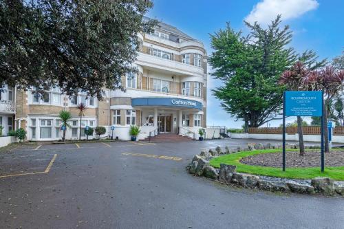 a building with a blue sign in front of it at Bournemouth Carlton Hotel By Sunday in Bournemouth
