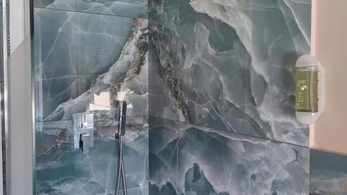 a wall with a painting of a mountain at Bed and Chic art rooms in Trieste
