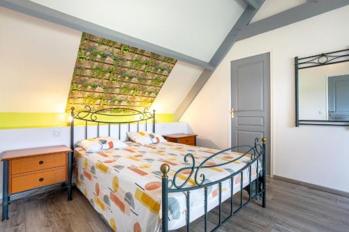 a bedroom with a bed in a room at Domaine de Kerroux in Bannalec