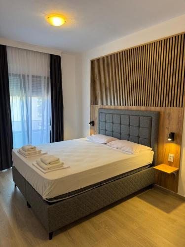 a bedroom with a large bed in a room at Golden Sands in Keramoti