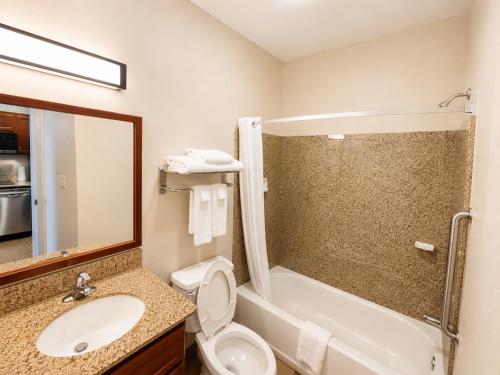 a bathroom with a sink and a toilet and a shower at Candlewood Suites Houston Westchase - Westheimer by IHG in Houston