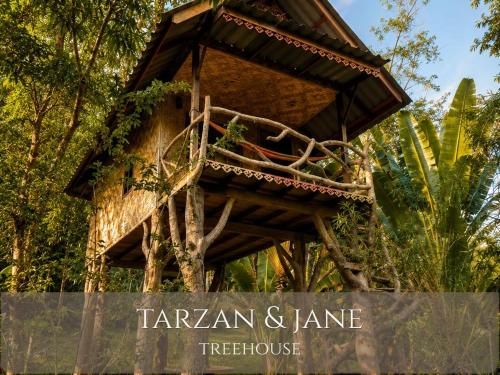 a tree house in the middle of a forest at Treehouses Yao Noi in Ko Yao Noi