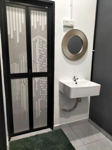 a bathroom with a sink and a mirror at 910 Entire Homestay Seremban Town, Templer, Lobak, Lekas Highway in Seremban