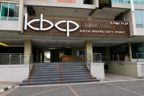 a building with a large sign on the front of it at Ain Studio Apartment in Kota Bharu