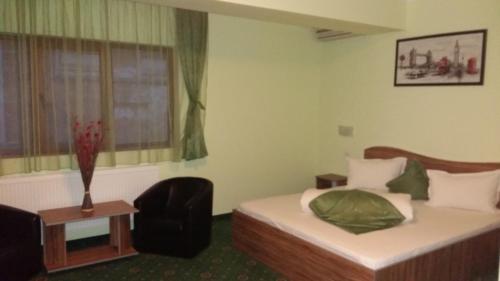 Postel nebo postele na pokoji v ubytování Hotel Corneliuss