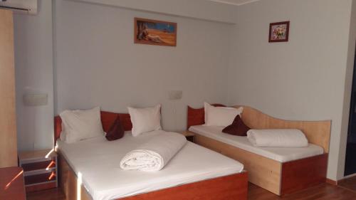 Postel nebo postele na pokoji v ubytování Hotel Corneliuss