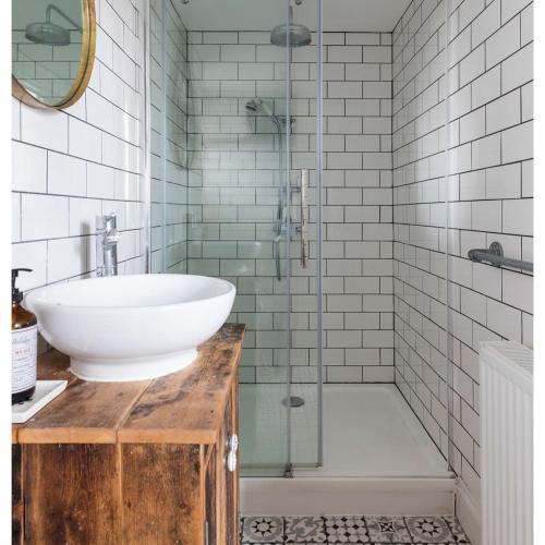 a bathroom with a sink and a shower at FERRY HOUSE stranraer in Stranraer