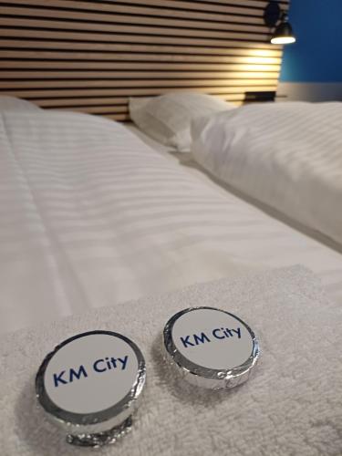 a pair of twin beds with their labels on them at Quiet Blue Room 2 on pedestrian street Saeby in Sæby