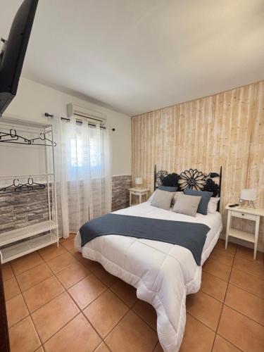 a bedroom with a large bed in a room at Casa Victoria in Antigua