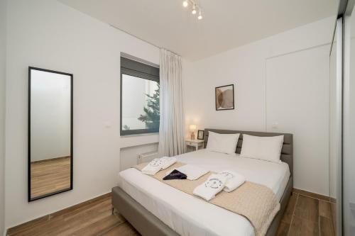 Riviera 1BR - 8 min Niarchos SNFCC by TwentyTwo