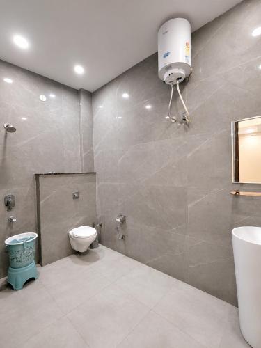 a bathroom with a toilet and a sink at Hotel KR Near Golden Temple in Amritsar