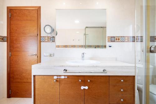 a bathroom with a sink and a mirror at Can Martinez in Llucmajor