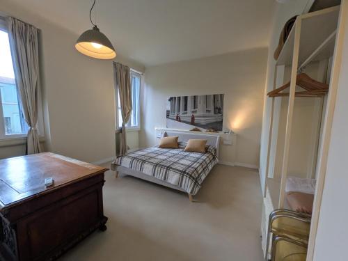 a bedroom with a bed and a couch in it at Fp Monza Railways in Monza