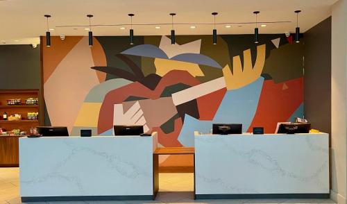 a large painting on the wall of a store at The Arlin, Arlington, a Tribute Portfolio Hotel in Arlington