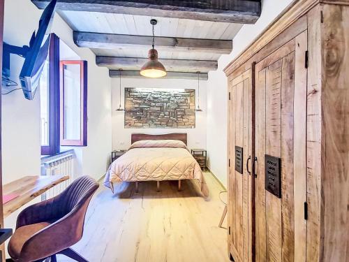 a bedroom with a bed and a table and chairs at Apartment Novecento by Interhome in Monterotondo