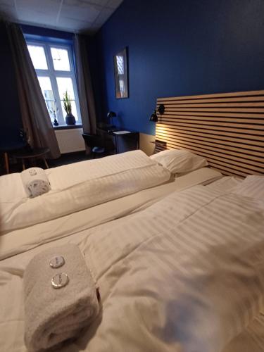 a bedroom with two beds and a window at Double Room 9 in Saeby in Sæby