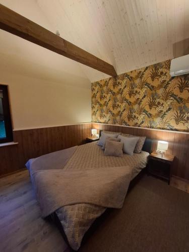 a bedroom with a large bed in a room at Pärna Muhu Island 2 in Paenase