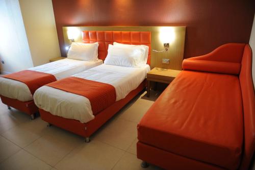 Letto o letti in una camera di Hotel Ristorante La Campagnola