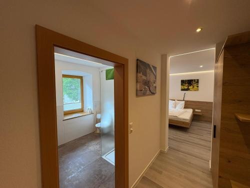 a room with a door leading to a bedroom at Frühstücks-Radpension Taurer-Thoman in Dellach im Drautal