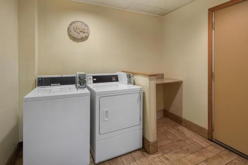 a laundry room with a washer and dryer at Best Western Indian Oak in Chesterton