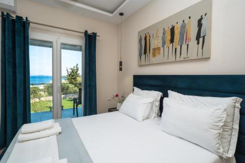 a bedroom with a white bed with a large window at Panorama Hideaway in Dassia