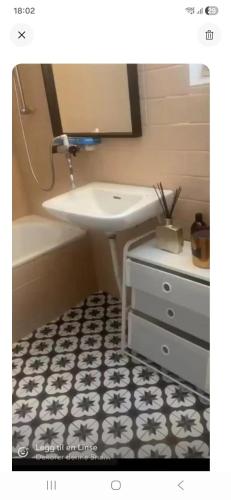 a bathroom with a sink and a bath tub at Casa Tolne in Sindal