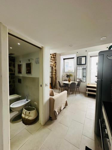 a large bathroom with a sink and a table at Victoria in Olbia