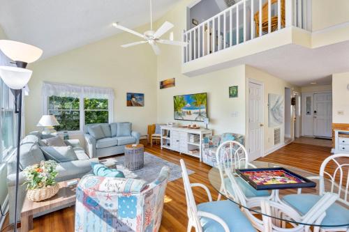 a living room with a couch and chairs at 6165 - Fantasy Land in Kill Devil Hills