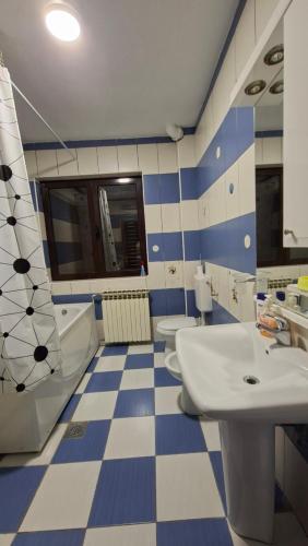 a bathroom with two sinks and two toilets at Natalia Rooms Old Town in Herceg-Novi
