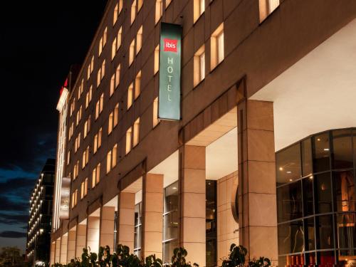 a building with a sign on the side of it at Ibis Warszawa Stare Miasto in Warsaw