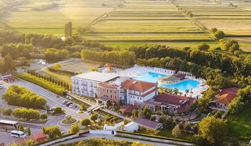 an aerial view of a mansion with a water fountain at Gardenland Resort in Shkodër