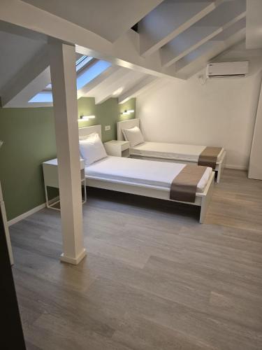 a bedroom with two beds in a room at Villa George in Constanţa