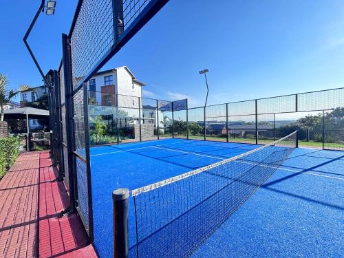 a tennis court with a net on top of it at Bohobeach Bliss! in Ballito