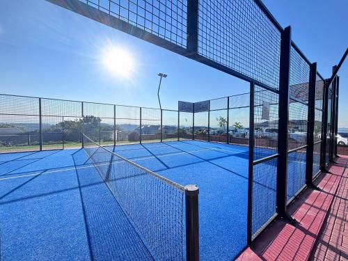 a tennis court with a net on a tennis court at The Pearl in Ballito