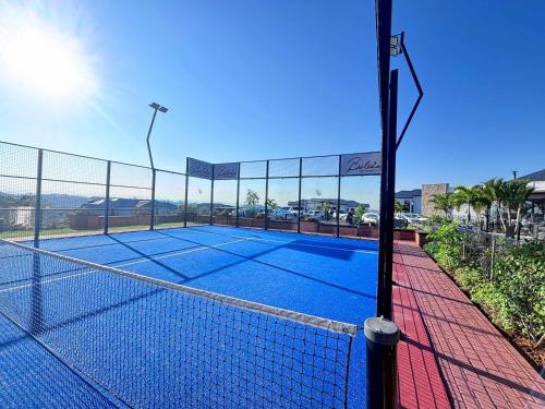 a tennis court with a net on top of it at Beach Paradise in Ballito