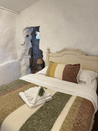 a bedroom with two beds with towels on them at BERGERIE A Murta, Domaine de l Ogliastru in Olmeto