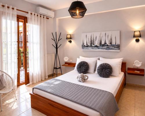 a bedroom with a bed with two balls on it at Villa Evgenia(Leonidas) in Ierissos