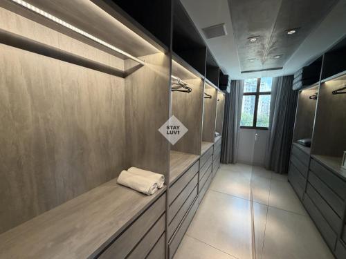 a bathroom with a shelf with a sign on it at Ville Celestine Condo Hotel 704 in Belo Horizonte