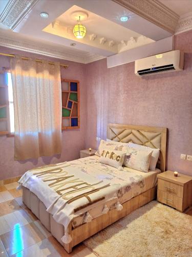 a bedroom with a large bed in a room at Oasis Menara in Marrakesh