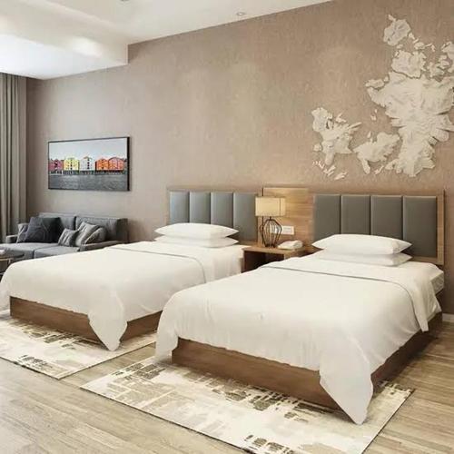 a bedroom with two beds and a couch at Beach hostel in Marsa Alam City