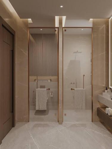 a large bathroom with a shower and a sink at Beach hostel in Marsa Alam City