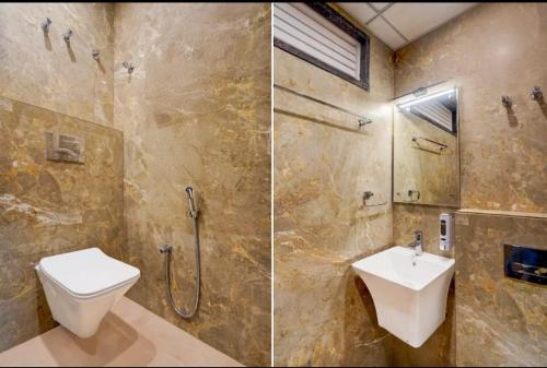 a bathroom with a toilet and a shower and a sink at Cross Lane- A Boutique Hotel-Kota in Kota