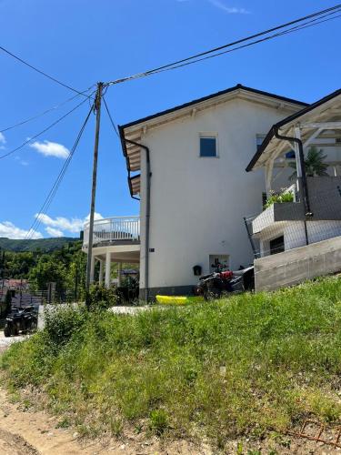 a white house on top of a hill at Vila jajcegrad in Jajce