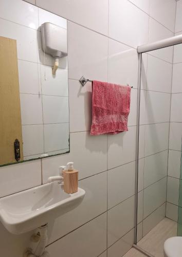 a white bathroom with a sink and a mirror at República Mandala - Quarto duplo 2 in Ouro Preto