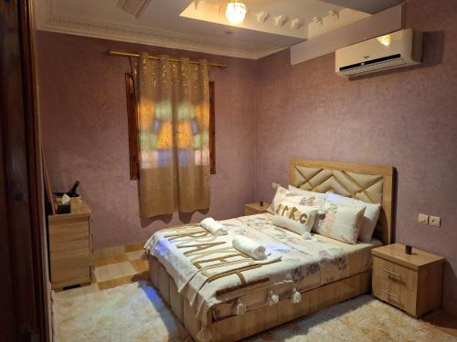 a bedroom with a bed and a window in it at Oasis Menara in Marrakesh