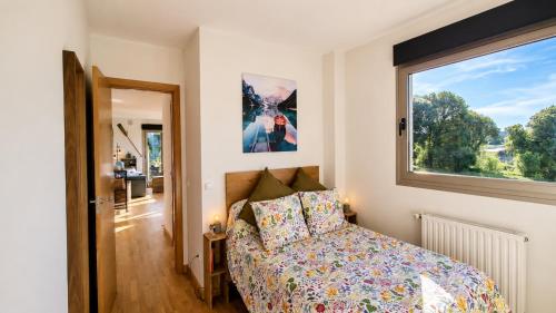 a bedroom with a bed and a window at Las Xanas · Vistas, Piscina y Terraza en LLanes in Llanes