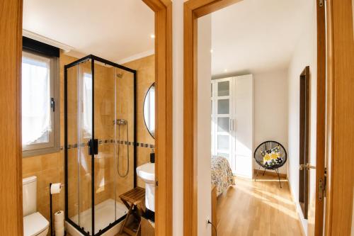 a bathroom with a shower and a sink at Las Xanas · Vistas, Piscina y Terraza en LLanes in Llanes
