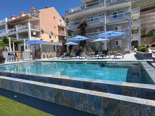 a large swimming pool in front of a building at Arba Seaview Residences Apartments in Mlini