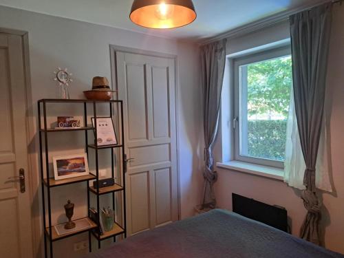 a bedroom with a bed and a window at szemesd6 in Balatonszemes